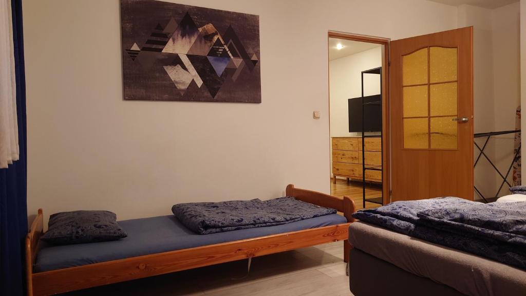 Posteľ alebo postele v izbe v ubytovaní Apartamenty nad Stonehenge