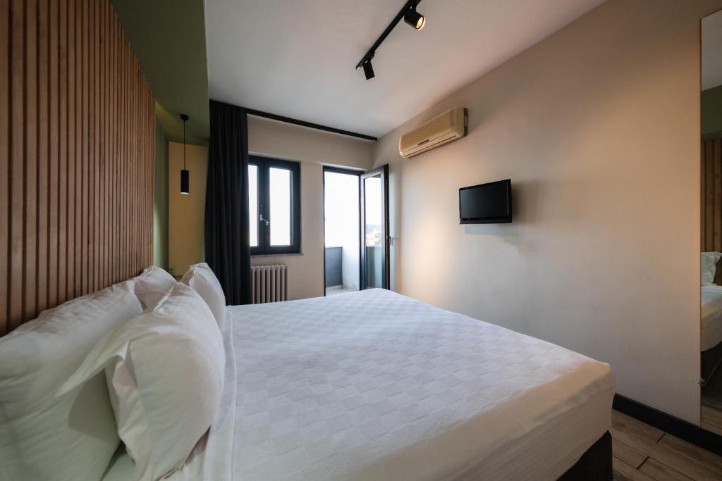 Postel nebo postele na pokoji v ubytování Polek Hotel