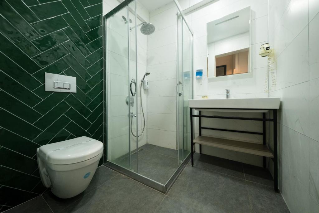 Koupelna v ubytování Polek Hotel