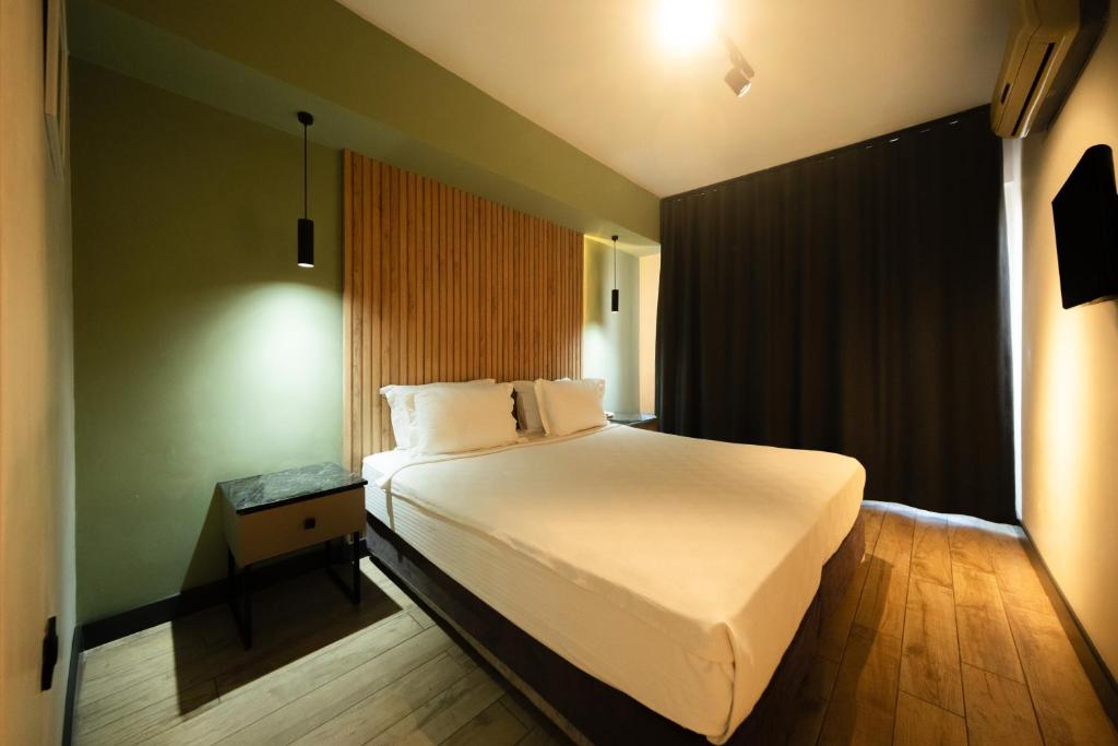 Postel nebo postele na pokoji v ubytování Polek Hotel