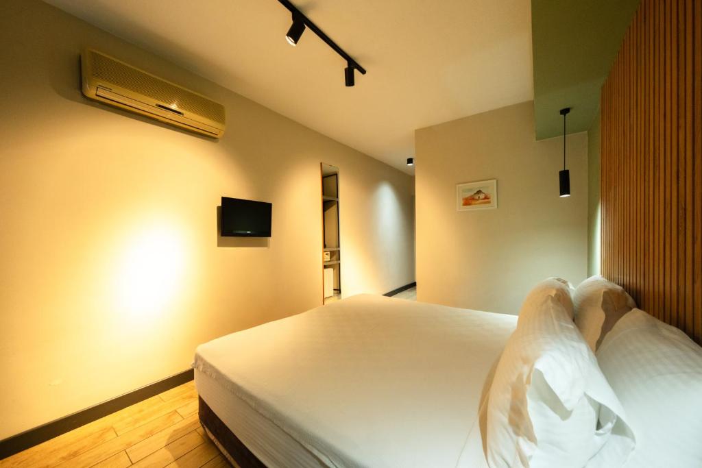 Postel nebo postele na pokoji v ubytování Polek Hotel