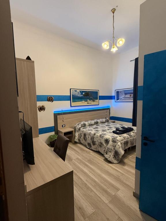 Postel nebo postele na pokoji v ubytování Albergo Astro