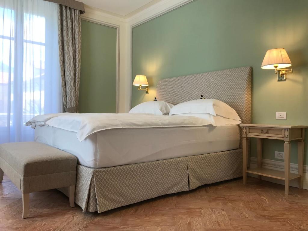 Postel nebo postele na pokoji v ubytování Villa Palmira Kinderfreies Hotel