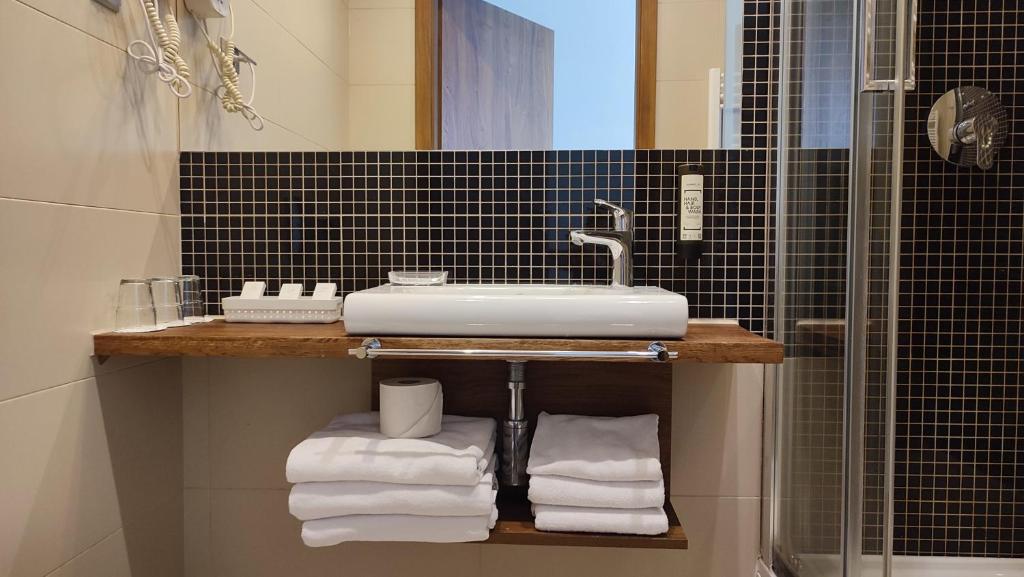 Koupelna v ubytování Hotel Gem