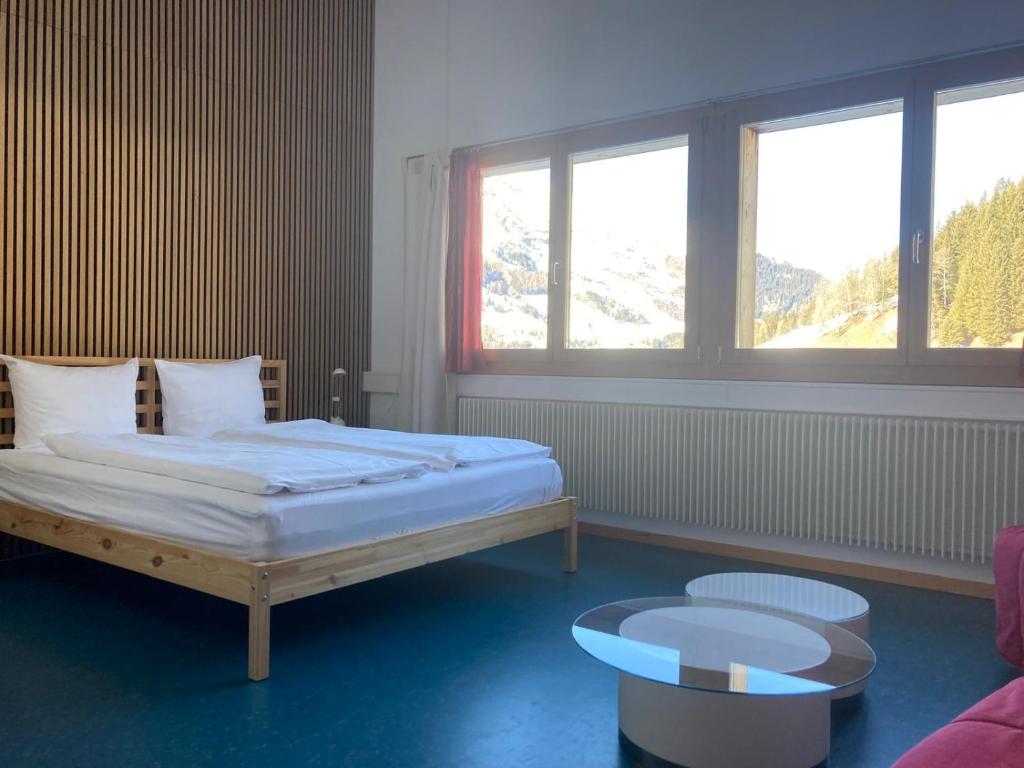 Postel nebo postele na pokoji v ubytování Shima-Davos