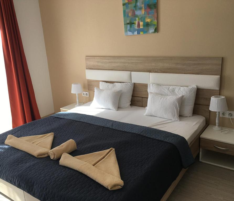 Postel nebo postele na pokoji v ubytování Hotel Pallone