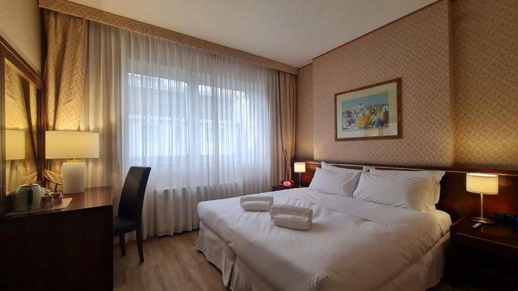 Postel nebo postele na pokoji v ubytování Garden Hotel Michelangelo