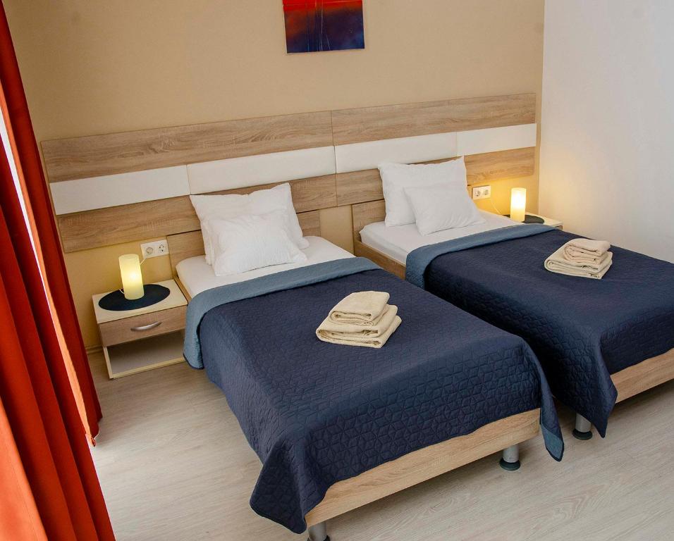 Postel nebo postele na pokoji v ubytování Hotel Pallone