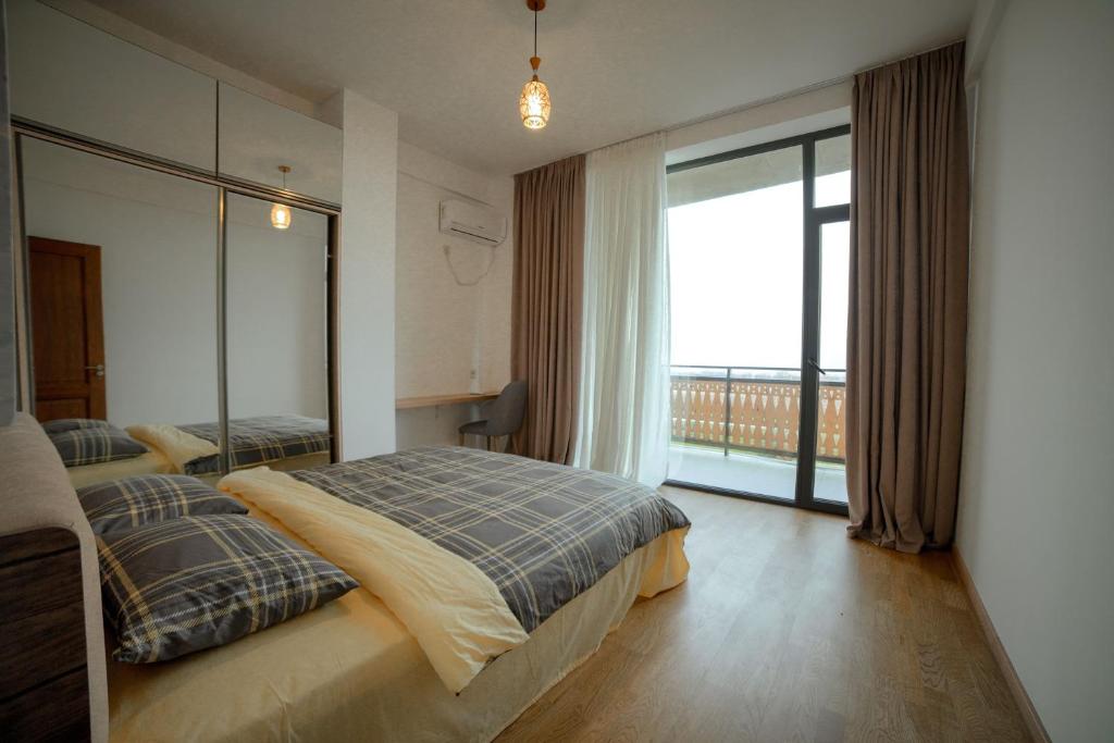 Postel nebo postele na pokoji v ubytování Luxury Villas in Alazani Valley Residence