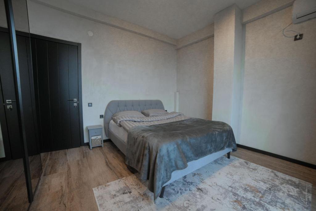 Postel nebo postele na pokoji v ubytování Luxury Villas in Alazani Valley Residence