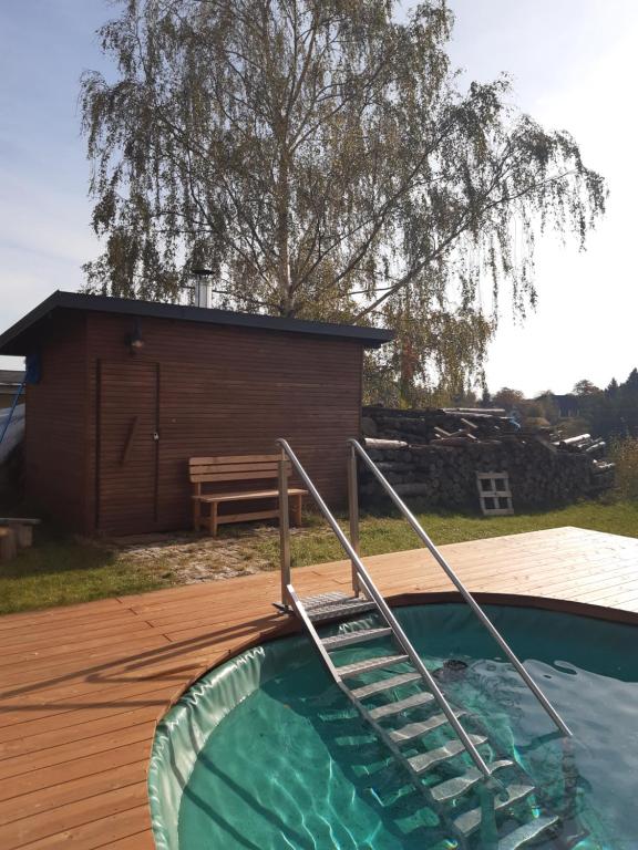 Bazén v ubytování Duhová sova nebo v jeho okolí