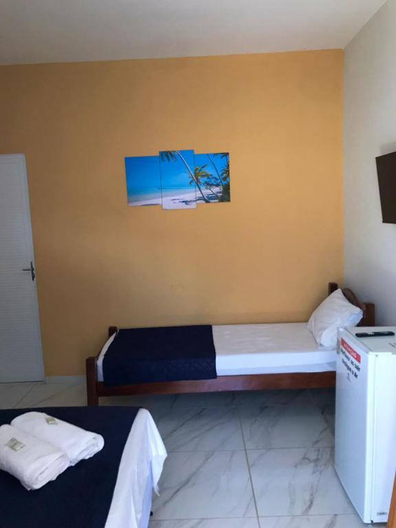 Postel nebo postele na pokoji v ubytování Pousada Caminho de Moises