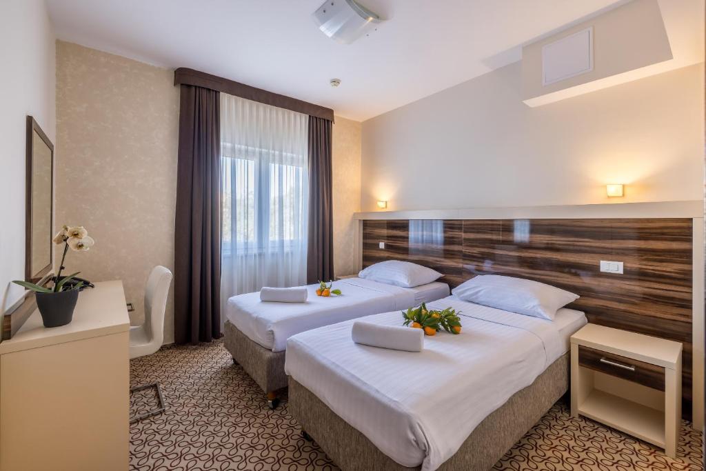 Postel nebo postele na pokoji v ubytování Hotel Terra