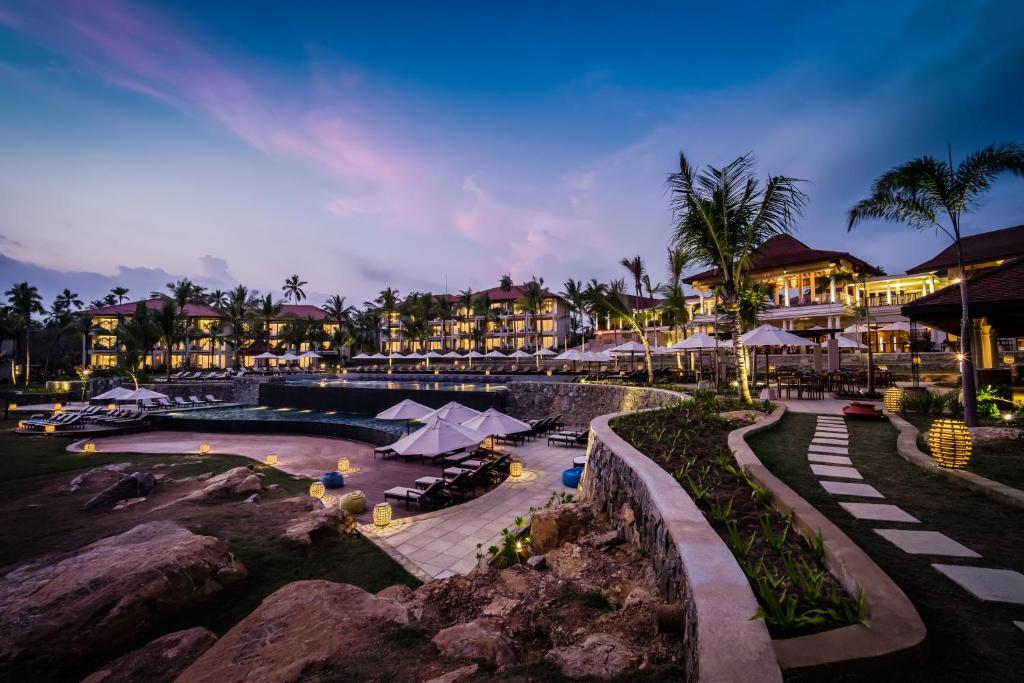 a resort with a swimming pool and a resort at Anantara Peace Haven Tangalle Resort in Tangalle