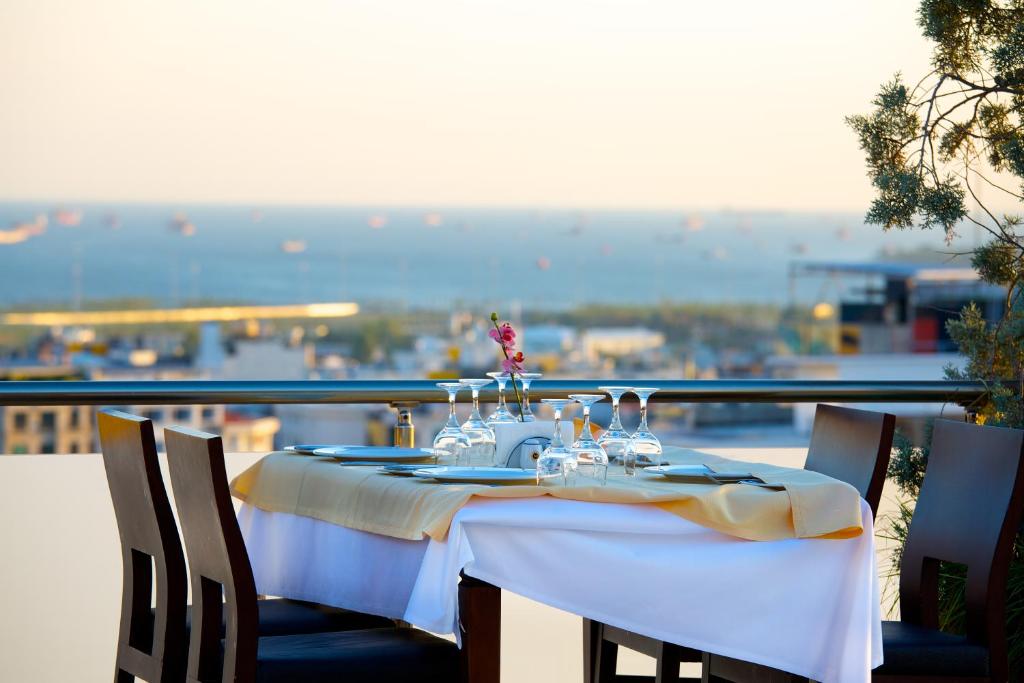 a table on a balcony with a view of the water at Mosaic Hotel Old City -Special Category in Istanbul
