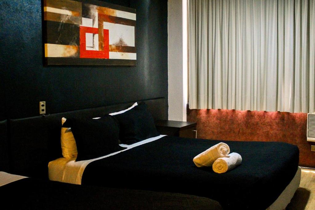 Postel nebo postele na pokoji v ubytování Hotel Sonetto