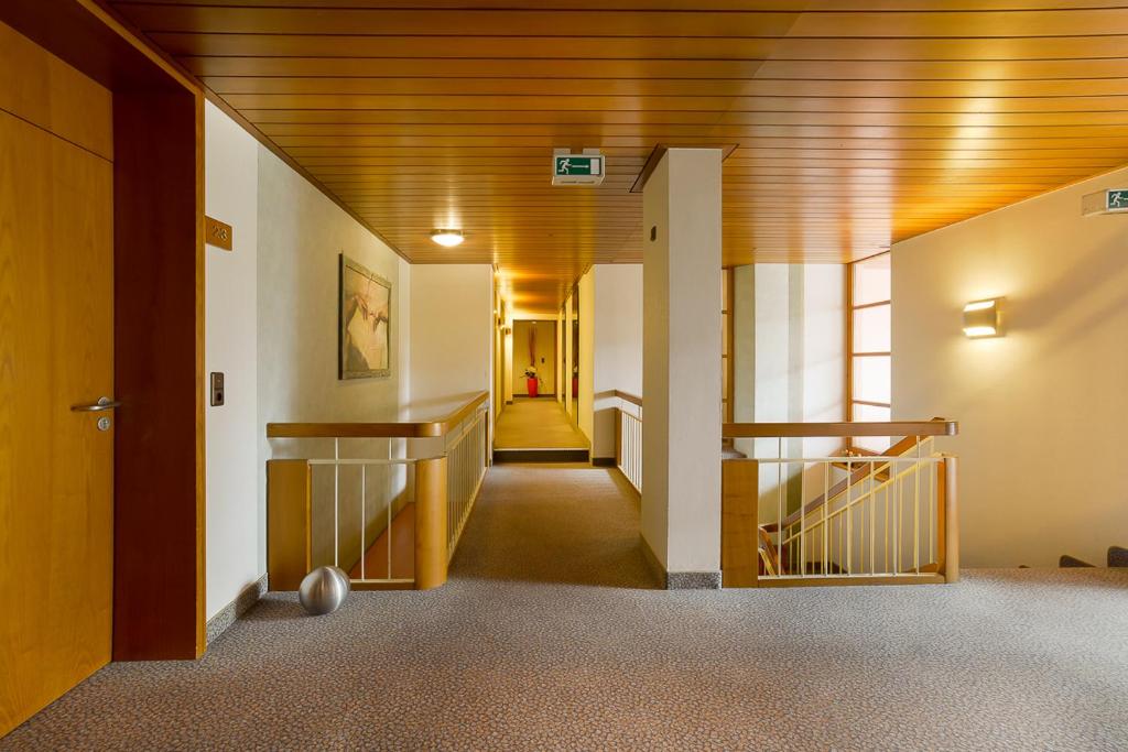 Postel nebo postele na pokoji v ubytování Hotel am Brenner
