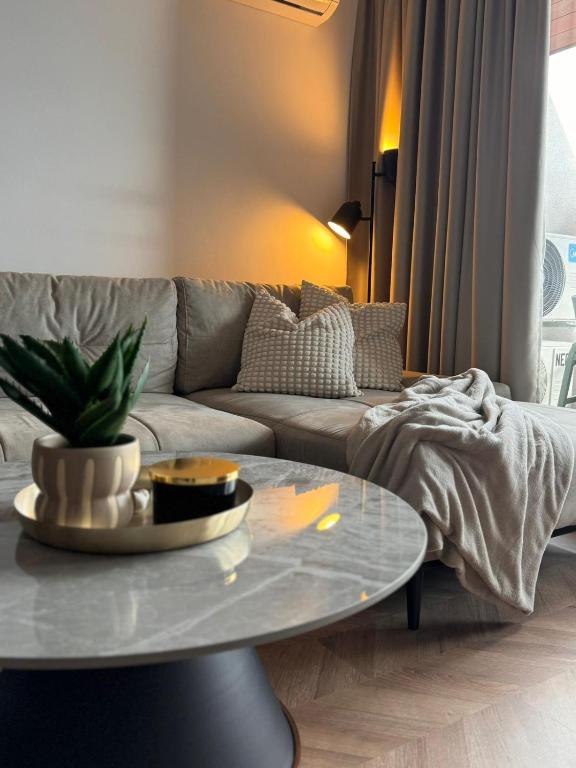 a living room with a couch and a coffee table at SeaView Etara IV Apartment in Sveti Vlas in Sveti Vlas