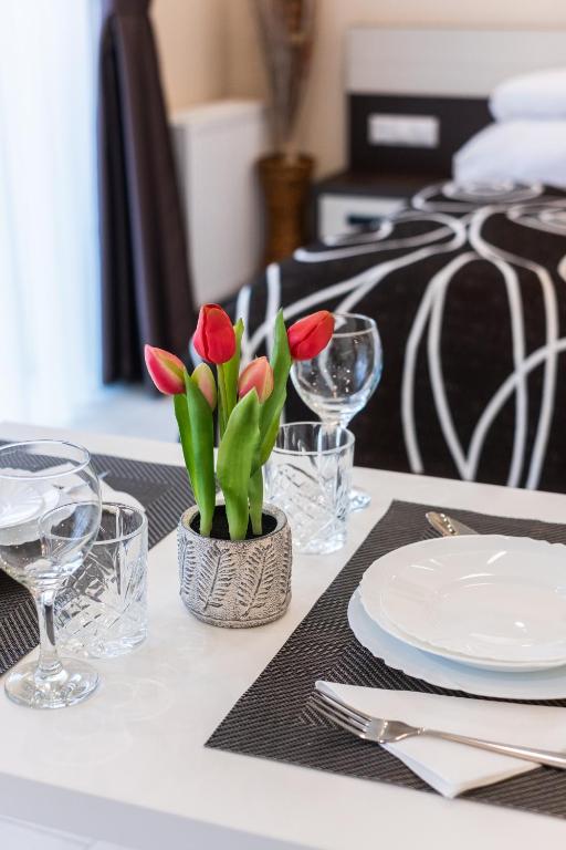 Postel nebo postele na pokoji v ubytování Németh Apartmanok