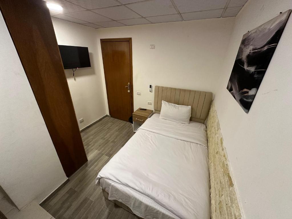 Postel nebo postele na pokoji v ubytování Egy Days Hotel