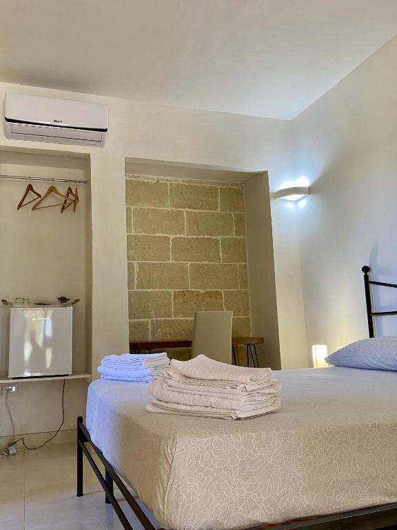 Postel nebo postele na pokoji v ubytování Le stanze di Ray - Salento Homes