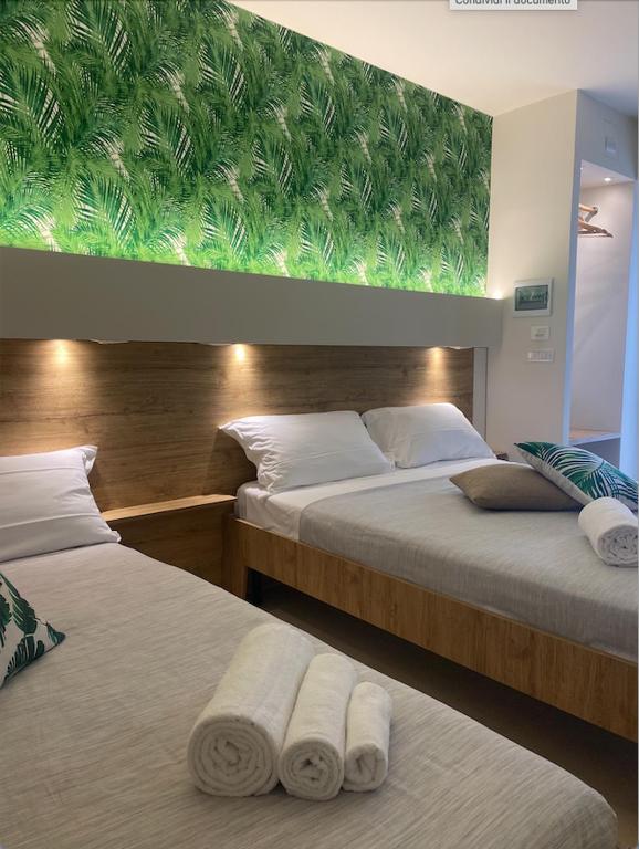 Postel nebo postele na pokoji v ubytování La Volta Rooms Locazione turistica