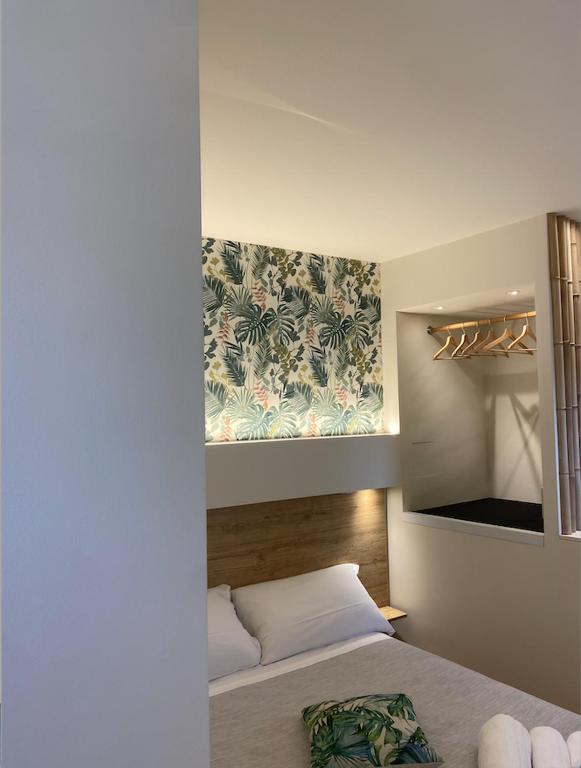 Postel nebo postele na pokoji v ubytování La Volta Rooms Locazione turistica