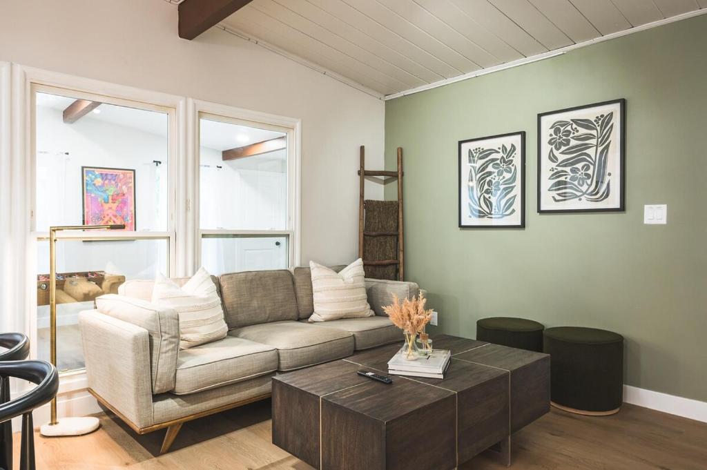 a living room with a couch and a coffee table at City Oasis - Entire Designer House - Near Disneyland in Hacienda Heights