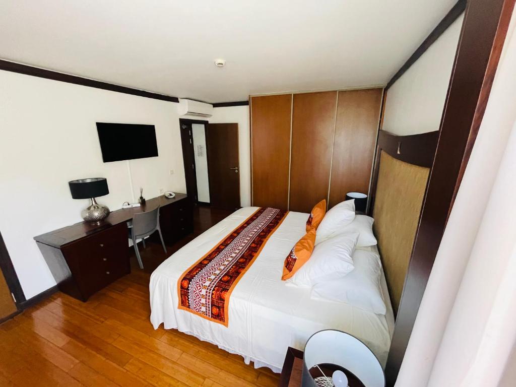 Voodi või voodid majutusasutuse Coral suite vue sur mer toas