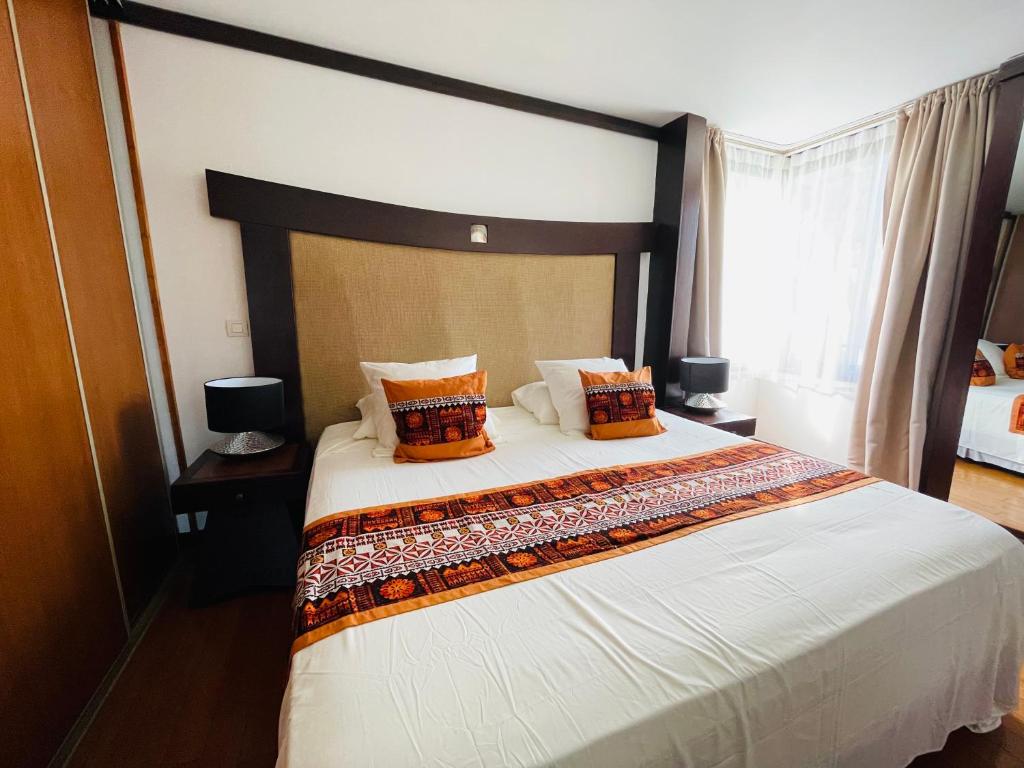 Voodi või voodid majutusasutuse Coral suite vue sur mer toas