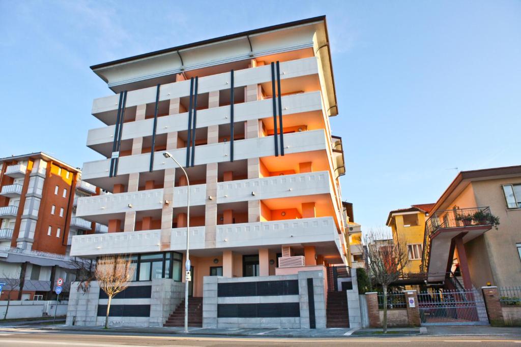 a tall building with a lot of windows at Capitol Apartments in Grado