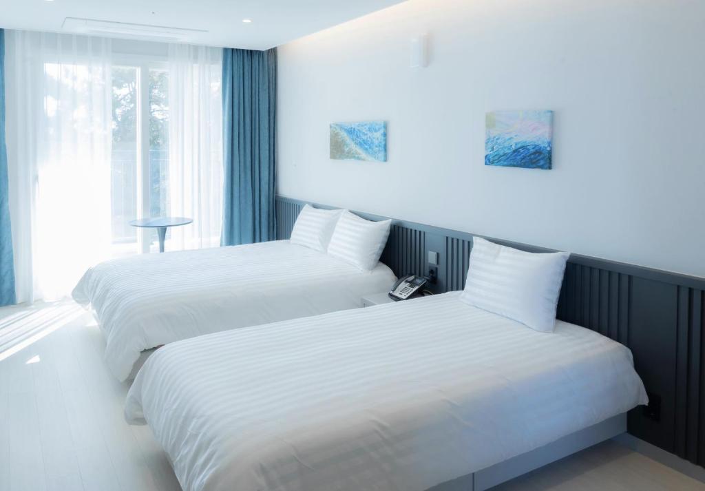 Postel nebo postele na pokoji v ubytování Hotel Sollavue