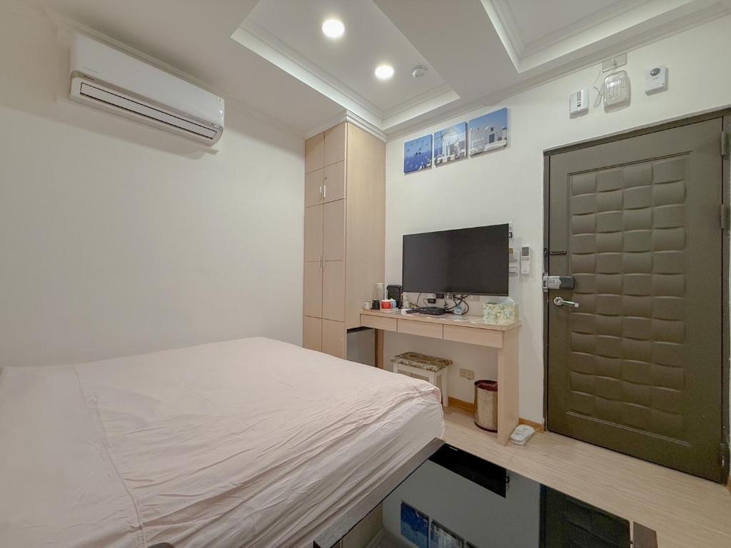 TV a/nebo společenská místnost v ubytování Tamshui Homestay