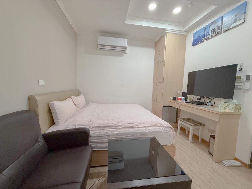 TV a/nebo společenská místnost v ubytování Tamshui Homestay
