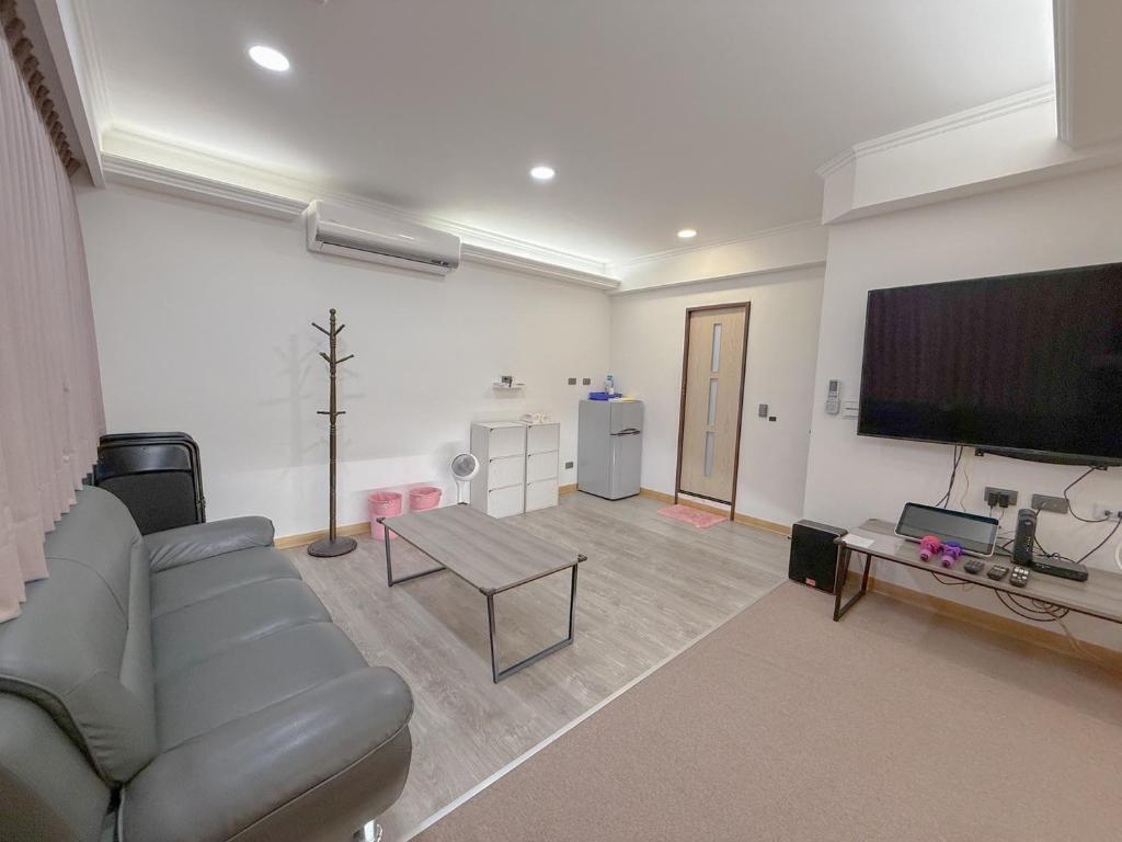 TV a/nebo společenská místnost v ubytování Tamshui Homestay