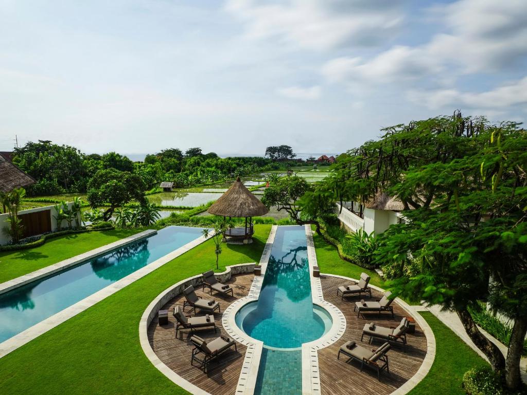 an aerial view of the pool at the resort at The Samata by LifestyleRetreats in Sanur