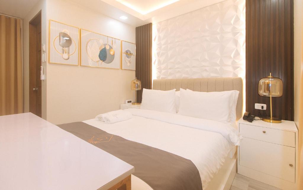 Postel nebo postele na pokoji v ubytování Grospe Resort Boracay by RedDoorz