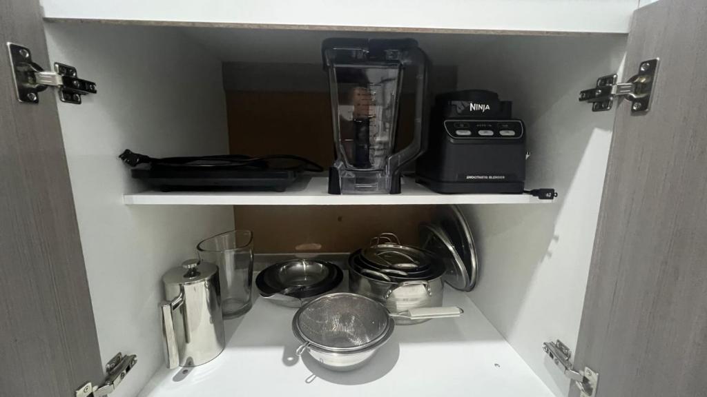 Kuchyň nebo kuchyňský kout v ubytování Hotel Suites La Maya