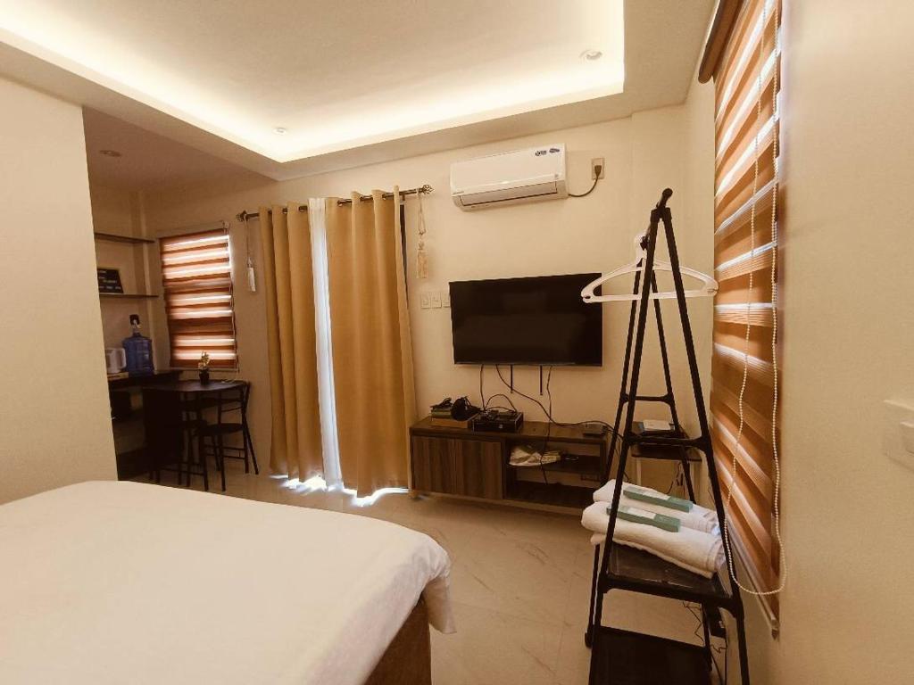 TV a/nebo společenská místnost v ubytování The wins residency