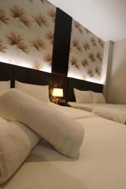 Postel nebo postele na pokoji v ubytování Casa Colney Hotel Ipoh