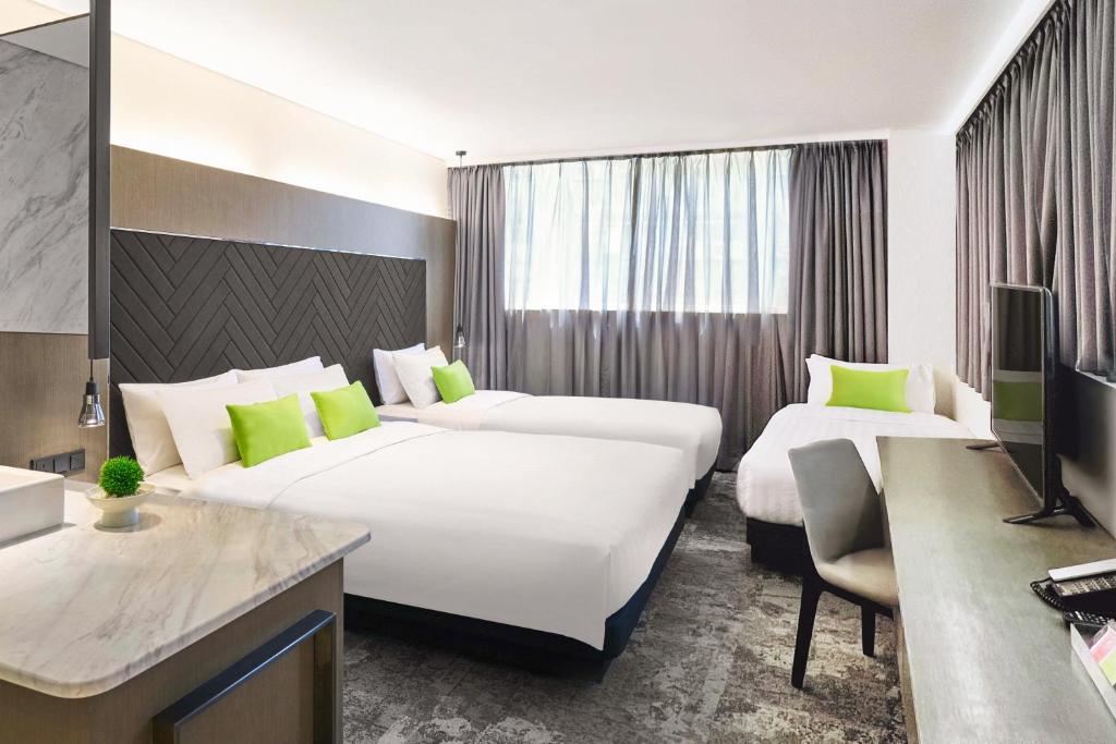Postel nebo postele na pokoji v ubytování Hotel Ease Tsuen Wan