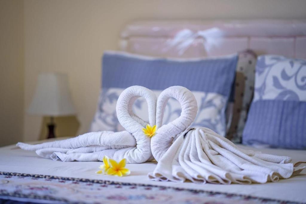 Postel nebo postele na pokoji v ubytování Whiterose Guesthouse