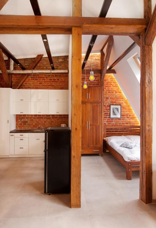 Posteľ alebo postele v izbe v ubytovaní Apartamenty Młyńska 4