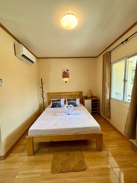 Postel nebo postele na pokoji v ubytování R&A Haven Guest House