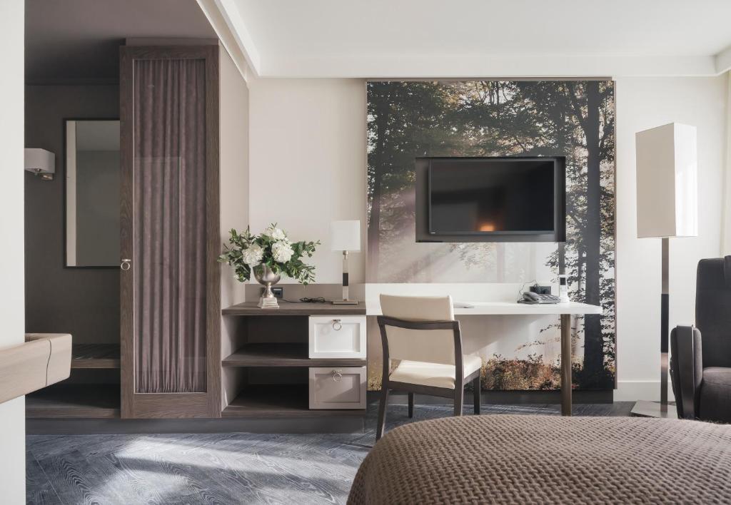 TV a/nebo společenská místnost v ubytování Hotel de Hoeve van Nunspeet