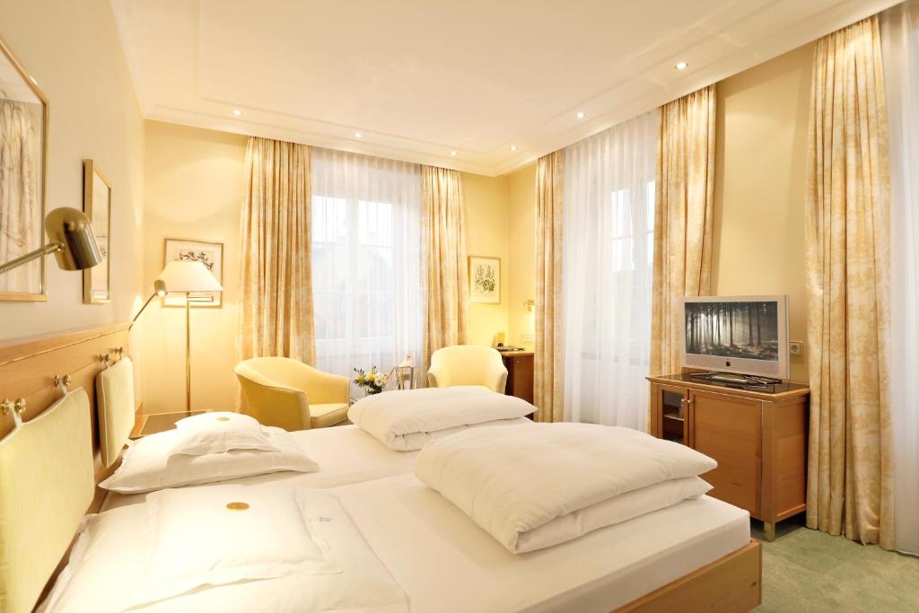 Postel nebo postele na pokoji v ubytování Hotel Reutemann-Seegarten