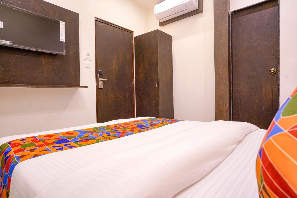 Postel nebo postele na pokoji v ubytování FabHotel Gateway