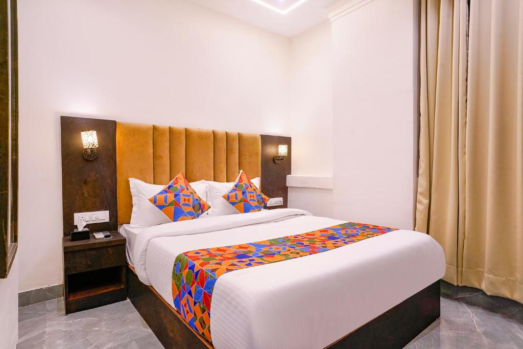 Postel nebo postele na pokoji v ubytování FabHotel Gateway
