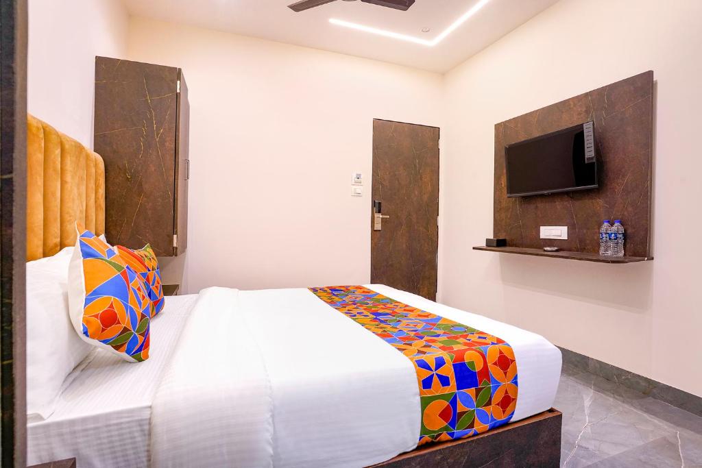 Postel nebo postele na pokoji v ubytování FabHotel Gateway