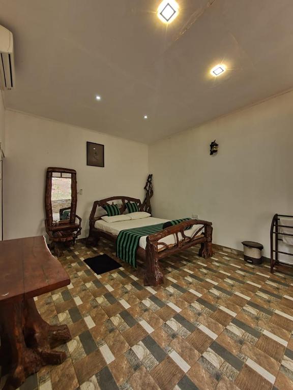 Postel nebo postele na pokoji v ubytování Prasanna Hotel and Rest